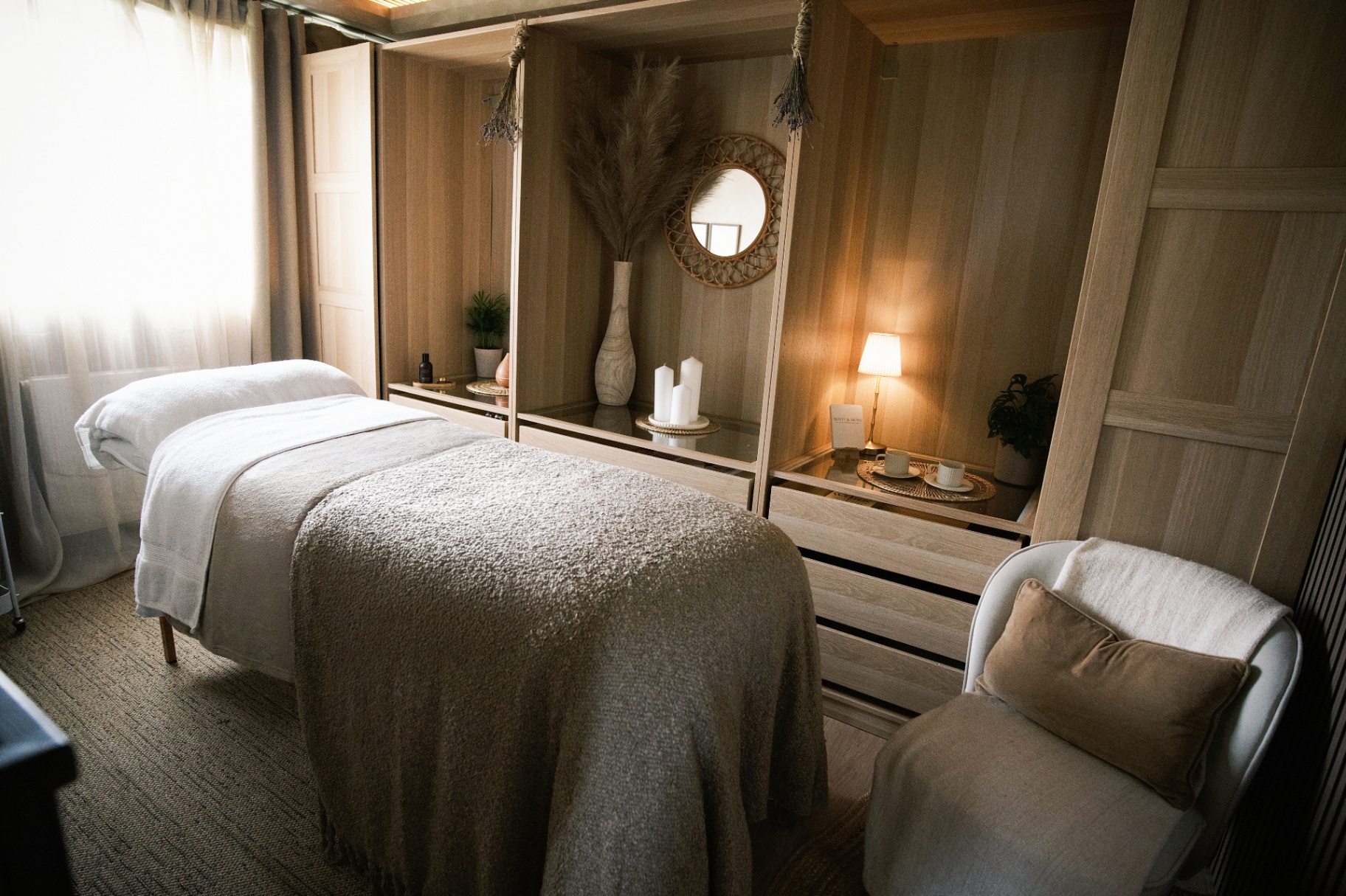 A calm treatment room prepared for a Root & Moss facial ritual
